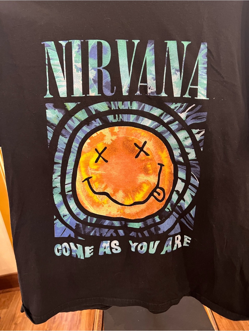 NIRVANA Black Tee with Orange Tie-Dye Smiley and Teal Accents
